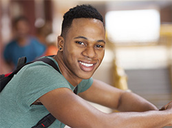 Young adult male with dental coverage