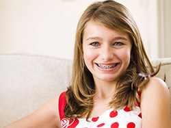 Young adult girl with braces